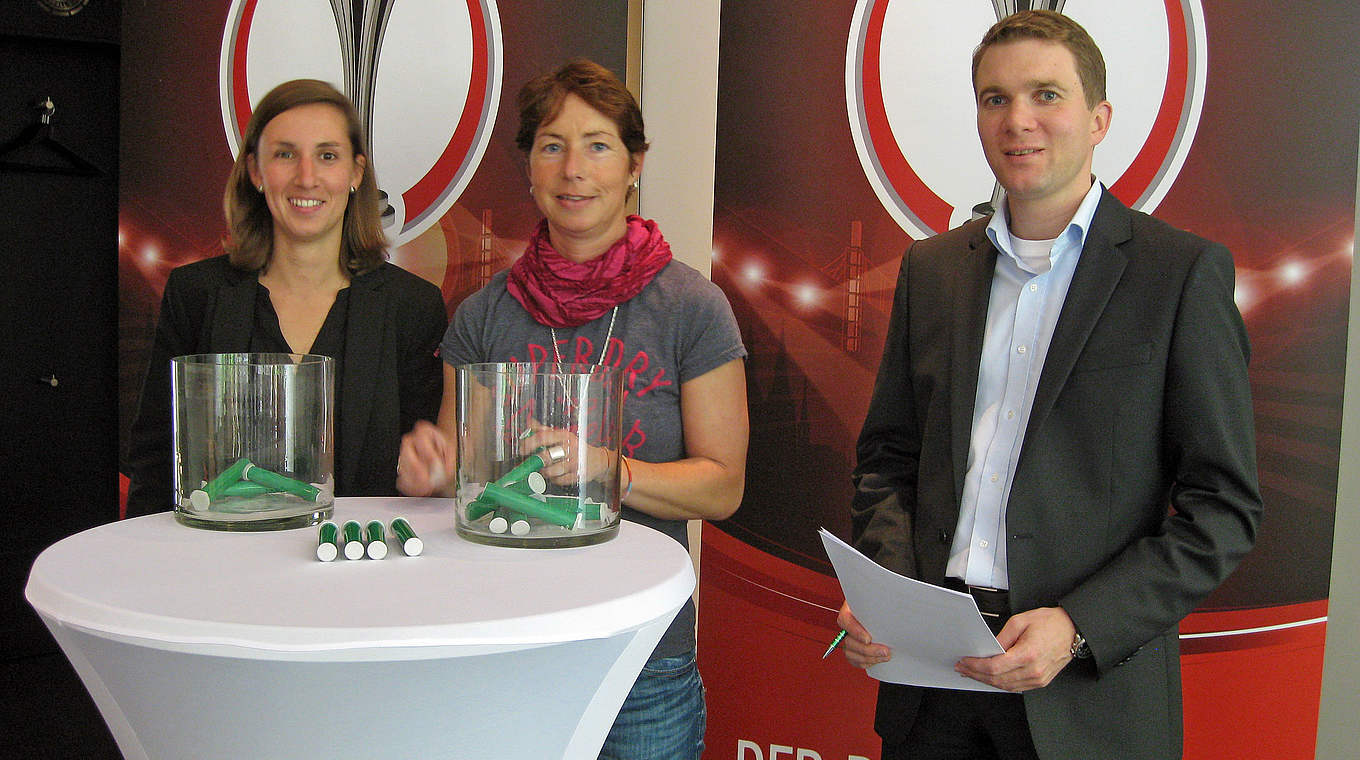 Germany national coach Maren Meinert (middle) chooses the draw for the second round of the DFB cup © DFB