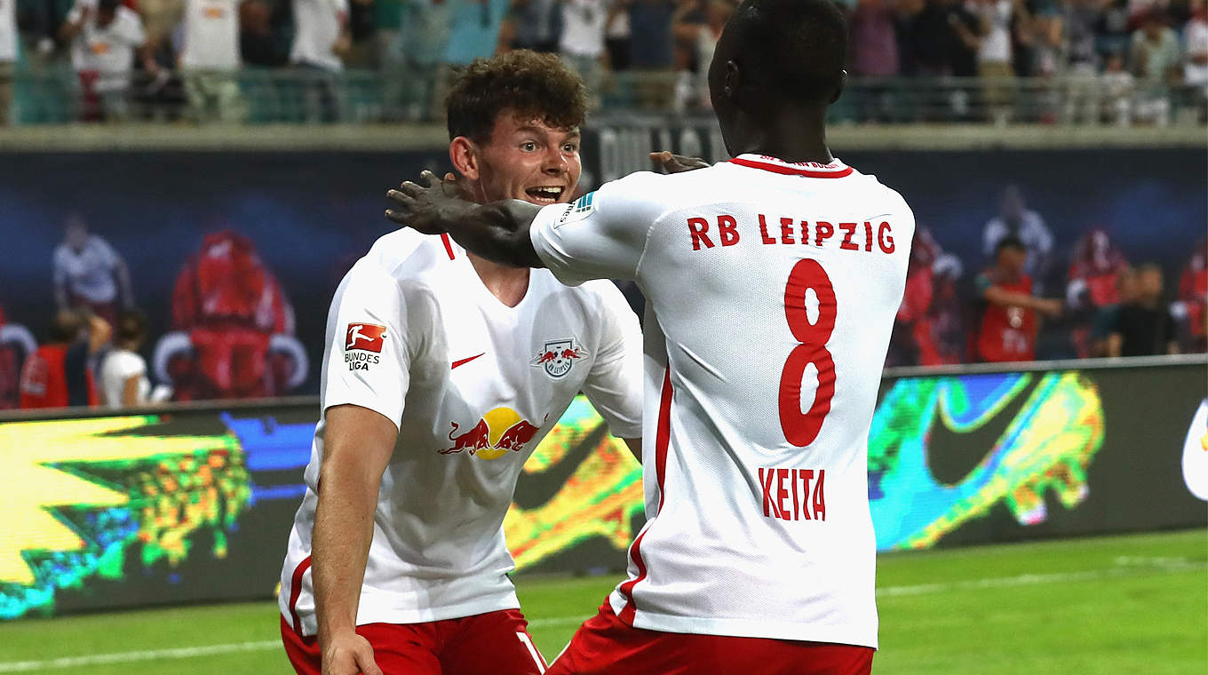 New signings Naby Keita and Oliver Burke celebrate a late winner for RB Leipzig © 